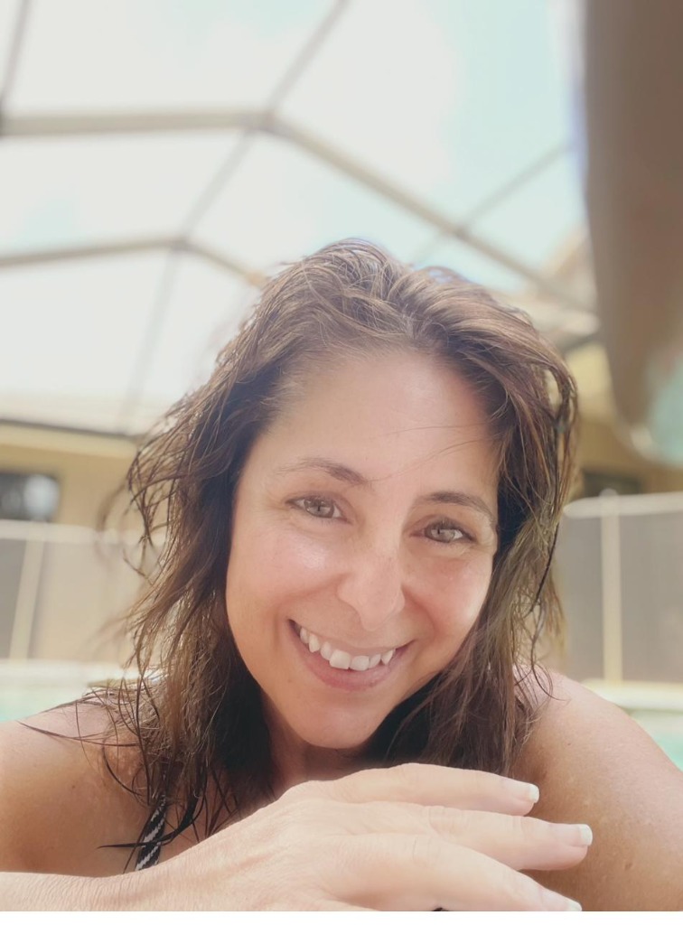 Founder of EcoFit USA, age 58, no makeup, no filter, at the pool